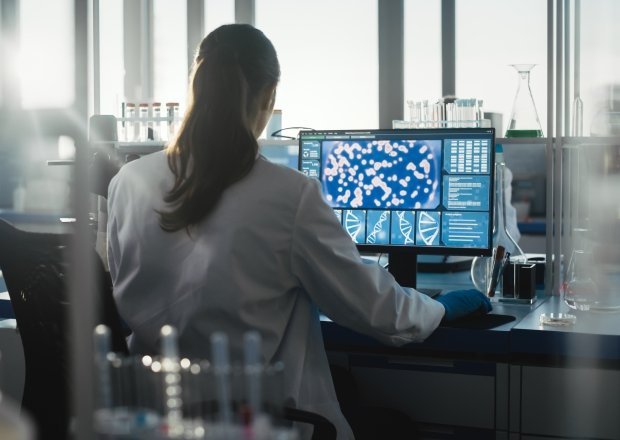 Scientist working on a computer