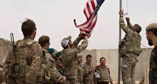 American flag being removed at an Afghan base