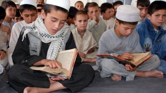 Schoolboys reading the Koran in Afghanistan