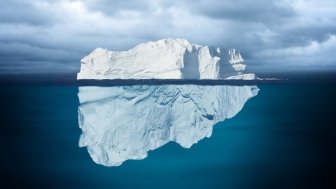 Iceberg Mostly Underwater Floating in Ocean