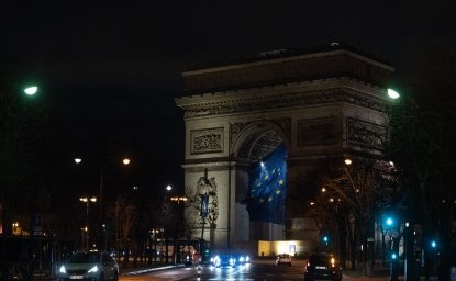 EU flag flying under the Arc de Triomphe