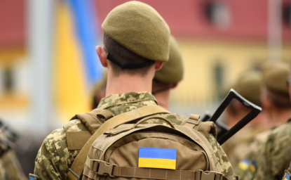 Soldier with Ukrainian Flag on Backpack