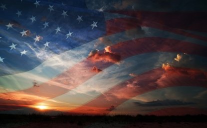 American flag against clouds