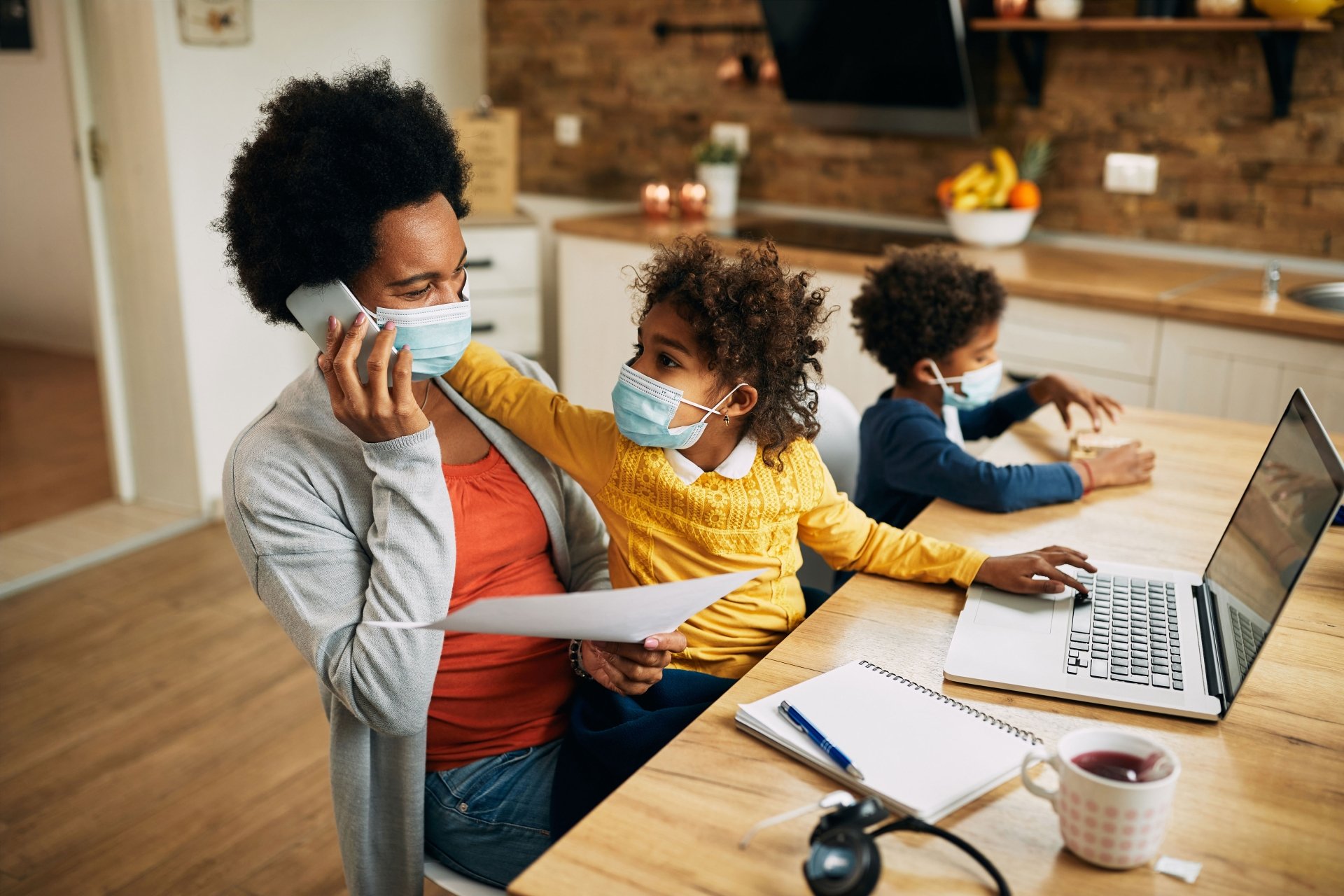 Working mom with child on lap