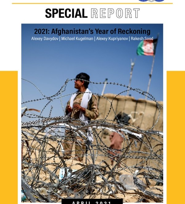 On the cover of the report is a picture of a man in a military uniform standing behind a barbed wire fence.