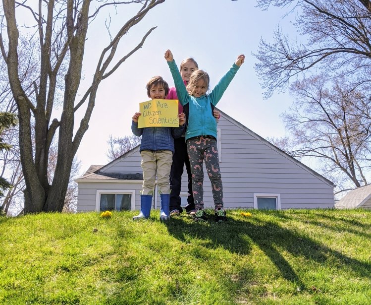 Children holding a sign of we are citizen scientists