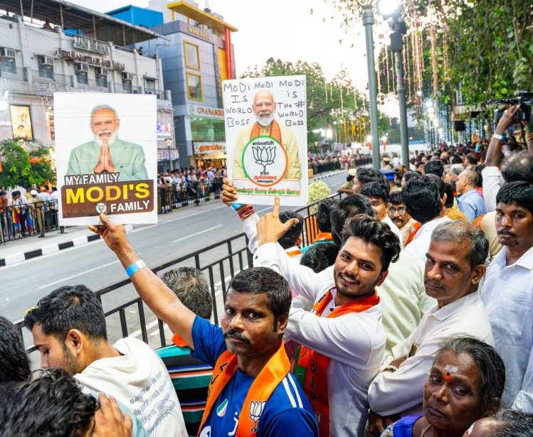 A picture of BJP supporters gathering with signs in support of Prime Minister Narendra Modi.
