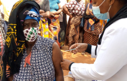 Woman receives vaccination in Mozambique.
