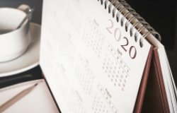 A close up of a desk calendar with the year 2020 visible