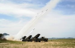 South Korean army units firing rockets.
