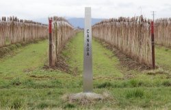 Canadian Border Marker stands on the 49th parallel/Canadian Border Marker/Canadian Border Marker divides Canada and the United States