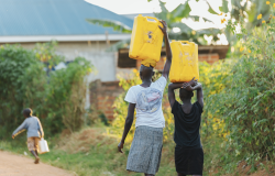 women carrying water in Uganda