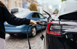 Person charging electric car