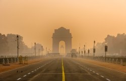Silhouette of triumphal arch style war memorial during smoggy winter morning