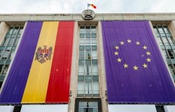 Large flags of Moldova and the European Union on the building of the government of Moldova on the eve of the summit of the European Political Community
