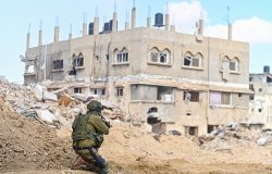 Han Yunis - Feb 7th 2024, Gaza stip. An IDF infantry commando soldier is covering towards ruin building.