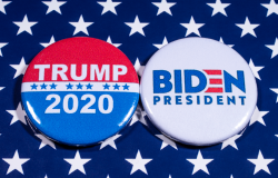 Donald Trump and Joe Biden pin badges, pictured of the USA flag. The two men will be battling eachother in the 2020 US Presidential Election. 